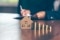 Modeling wooden houses and coins and dollars placed on wooden tables,preparation concept for house model purchase and the fastest growing real estate economy,moving home or renting property via agent; Shutterstock ID 1476453986; Purchase Order: 058